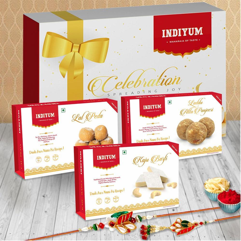 Indiyum Sweet Combo Rakhi Hamper For Bhaiya Bhabhi - Kaju Barfi 200g Atta Panjeeri Laddu 200g Lal Peda 200g Rakhi For Bhaiya Bhabhi Roli Chawal